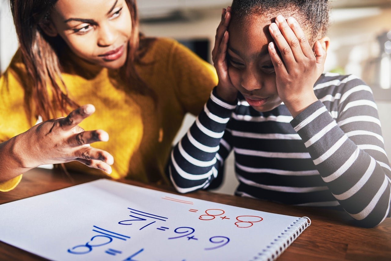 parent helps child do homework but child frustrated